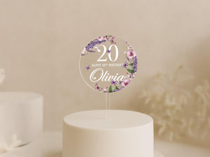 a white cake topped with a cake topper