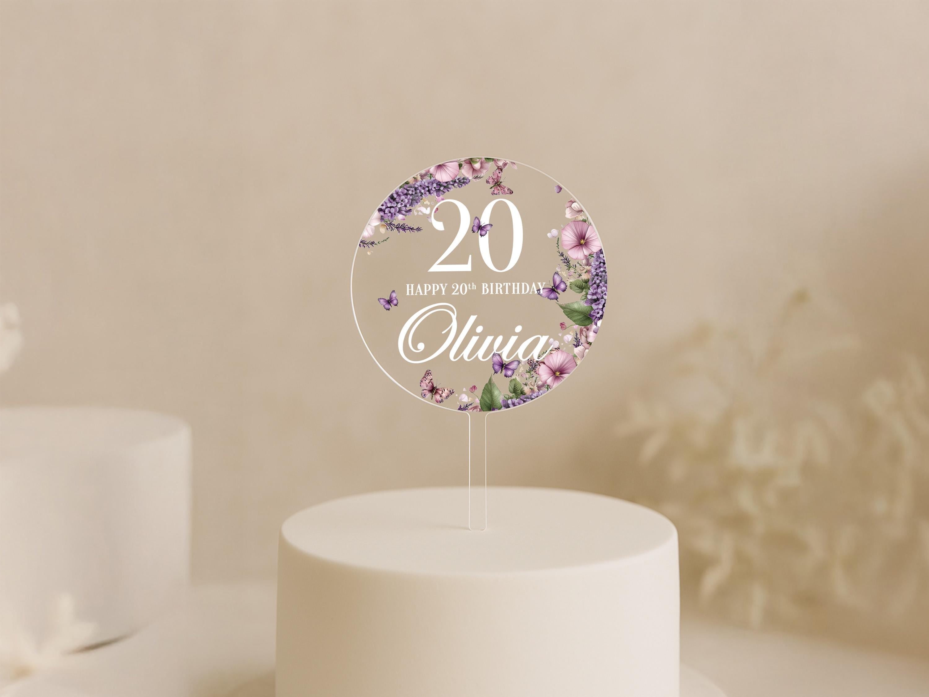 a white cake topped with a cake topper