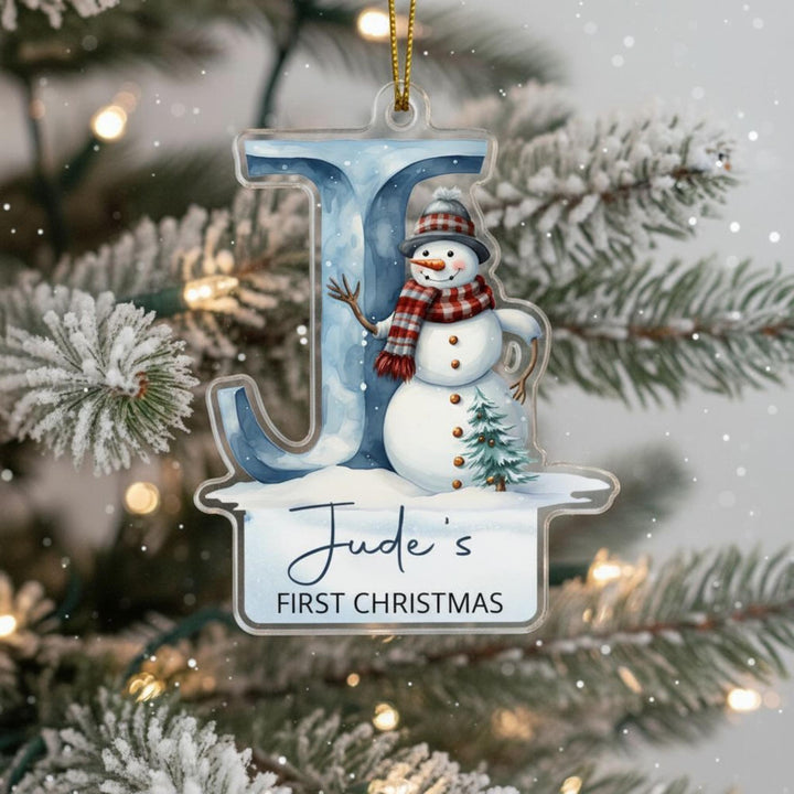 Personalised baby’s first Christmas ornament with letter J and snowman on Christmas tree.