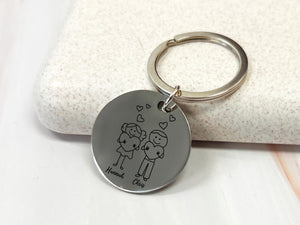 a keychain with a picture of a couple on it