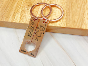 a couple of key chains sitting on top of a wooden table