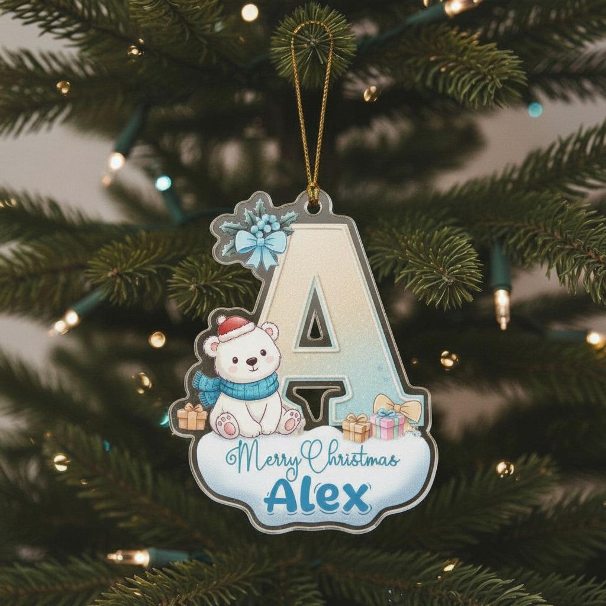 A Christmas ornament with a polar bear wearing a red hat and scarf, and the name "Alex" written on it.