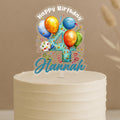 Personalised balloon birthday cake topper showing number 4 surrounded by colourful party balloons and custom name Hannah on white cake