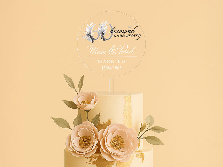 a three tiered wedding cake with flowers on top