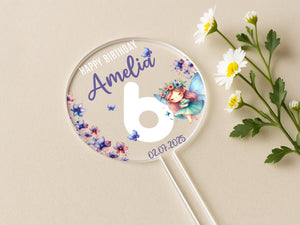 a personalized birthday lollipop next to a flower