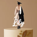 Personalised graduation cake topper with female graduate in cap and gown, custom name, class of 2025