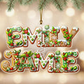 A decorative Christmas ornament with the names "EMILY & JAMES" written in a festive, holiday-themed font.