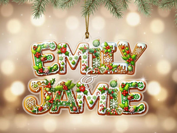A decorative Christmas ornament with the names &quot;EMILY & JAMES&quot; written in a festive, holiday-themed font.