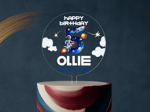 a birthday cake with a space theme on it