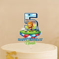 A birthday cake topper with a cartoon lion and soccer ball, along with the text "Happy Birthday Noah".