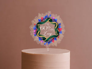A birthday cake with a decorative topper that says "Happy 60th Birthday Zoe".