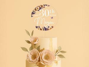 a three tiered cake with flowers on top