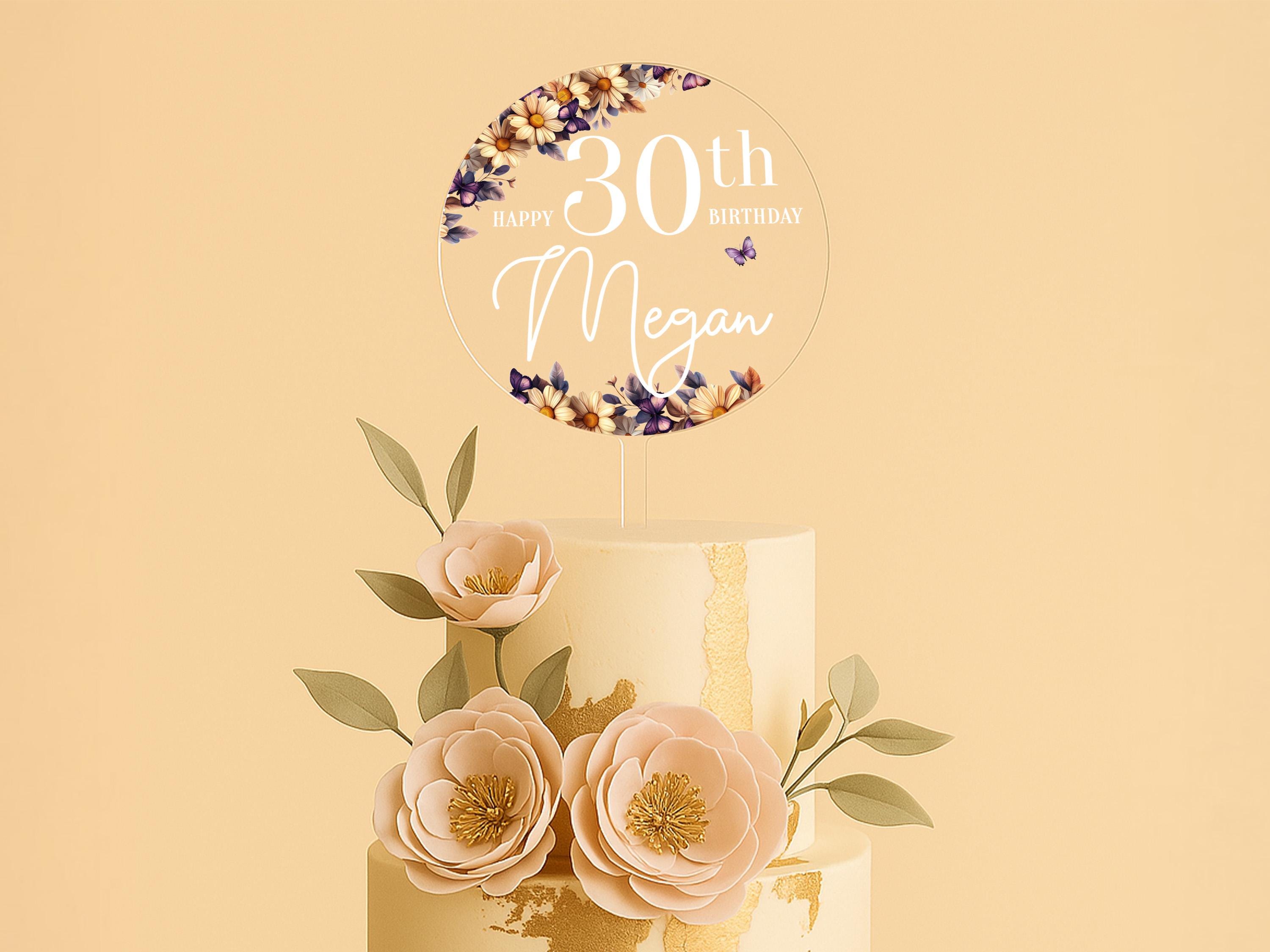 a three tiered cake with flowers on top