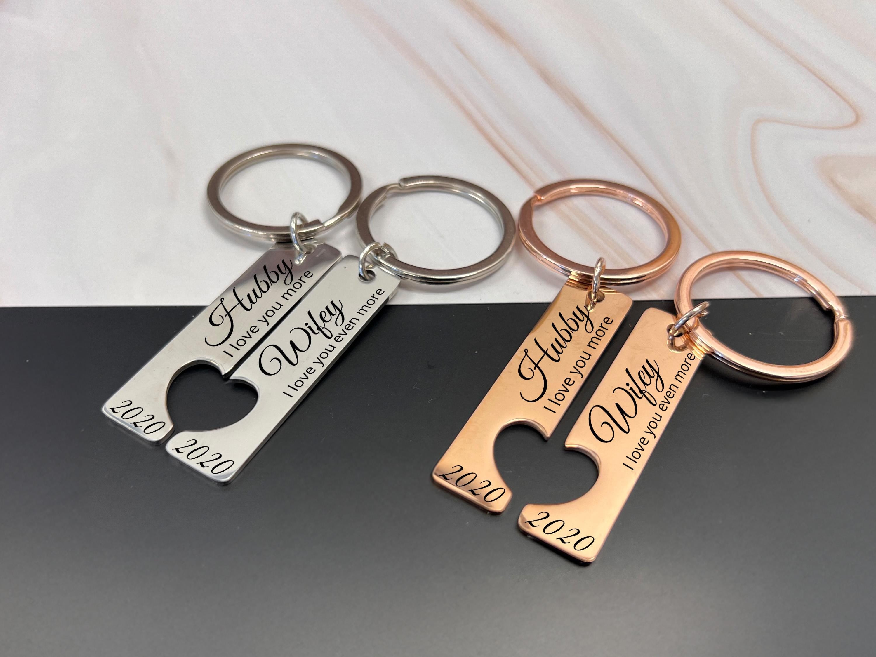 Close-up of romantic rose gold heart cut-out keyring set, featuring Hubby and Wifey inscriptions with year 2020, ideal for newlyweds.