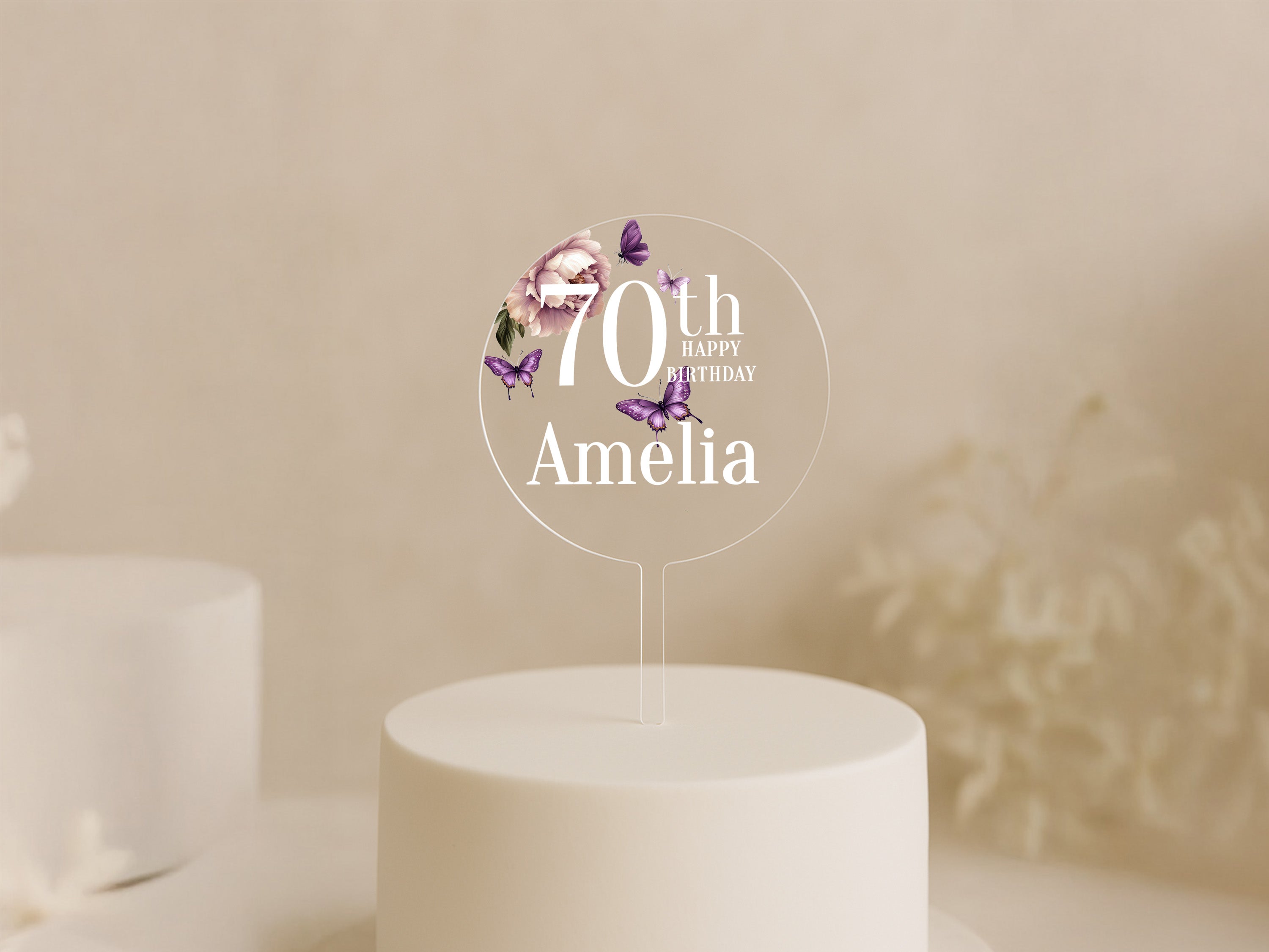 a white cake topped with a white frosted cake topper