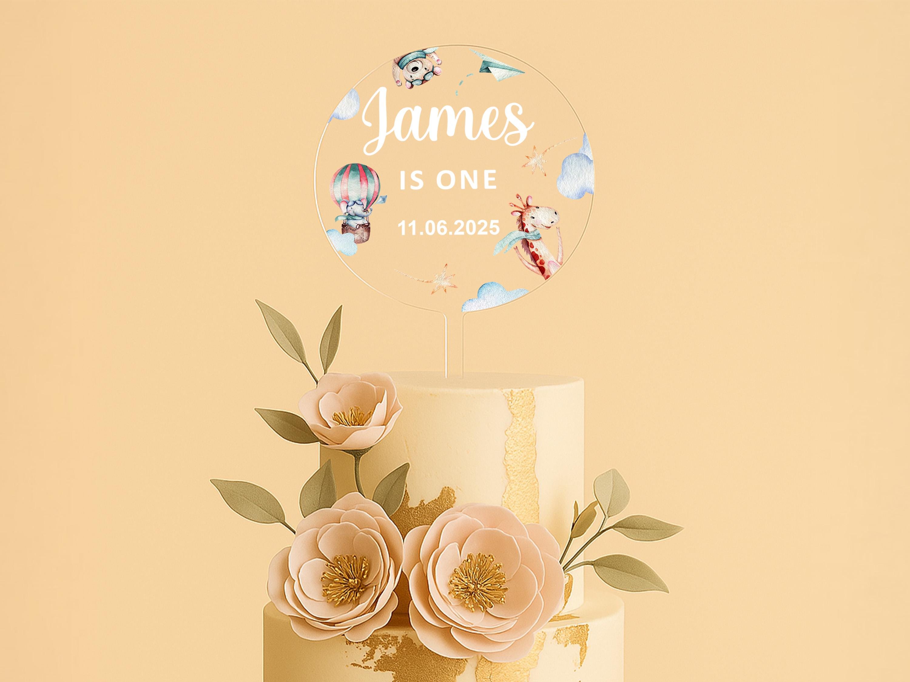 a three tiered cake with flowers on top