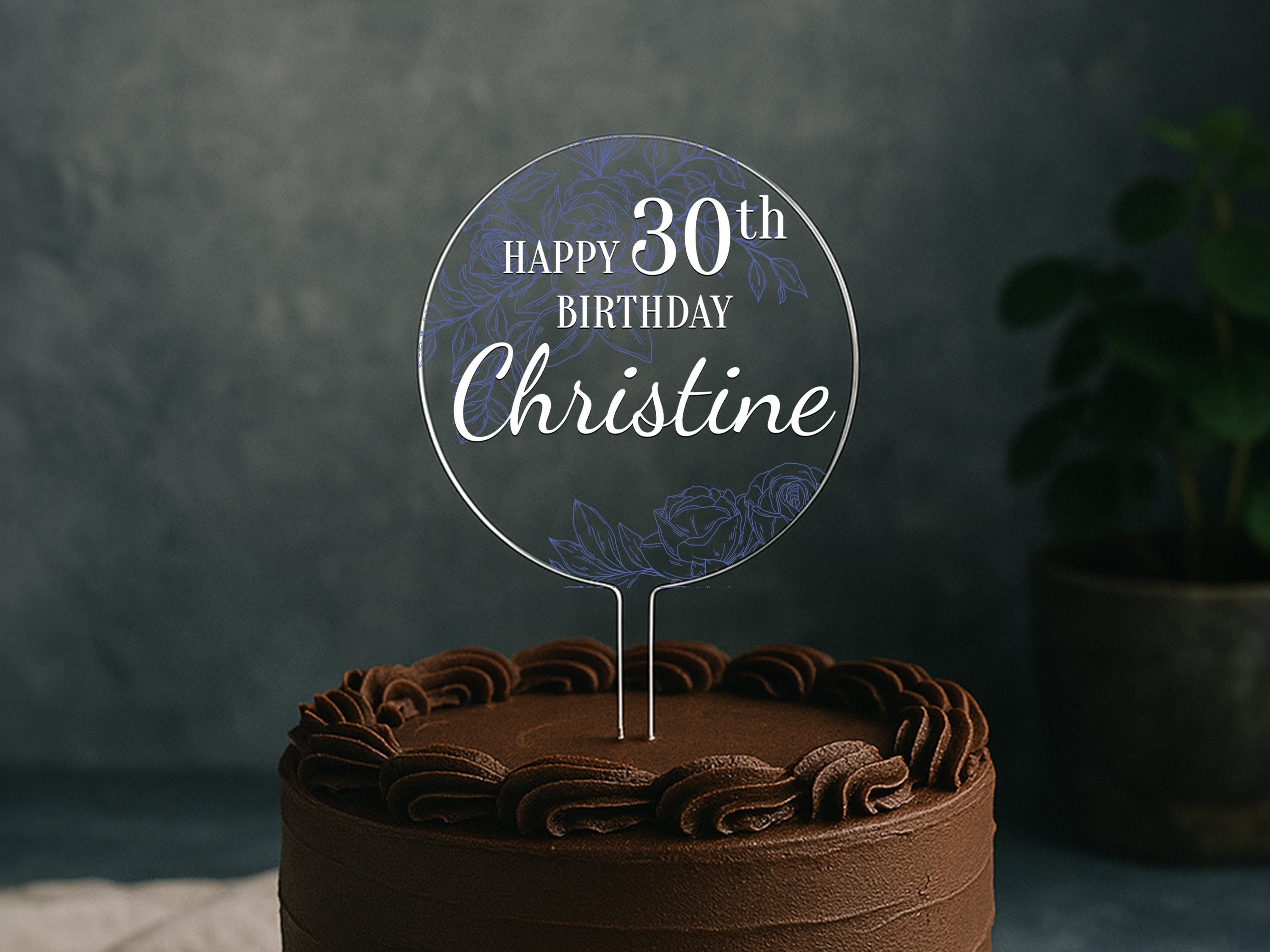 a chocolate cake with a happy birthday sign on top