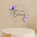a cake with a cake topper that says mr and mrs