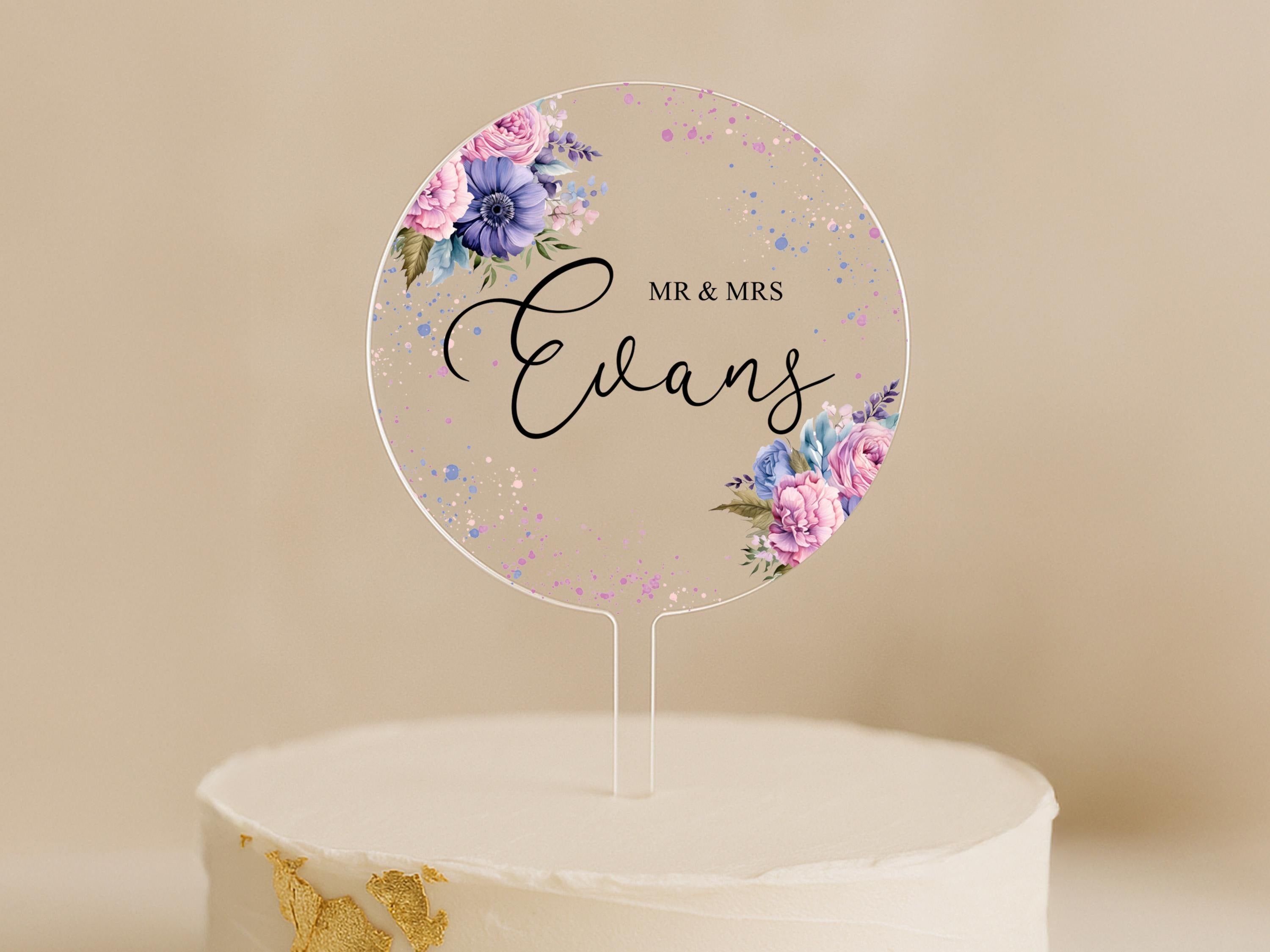 a cake with a cake topper that says mr and mrs