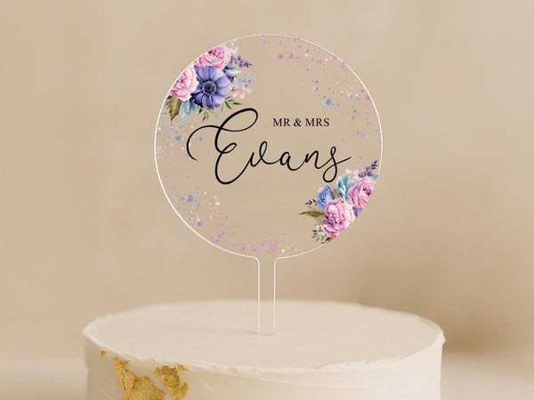 a cake with a cake topper that says mr and mrs