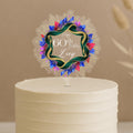 A white cake with a decorative topper that says "Happy 60th Birthday Zoey".