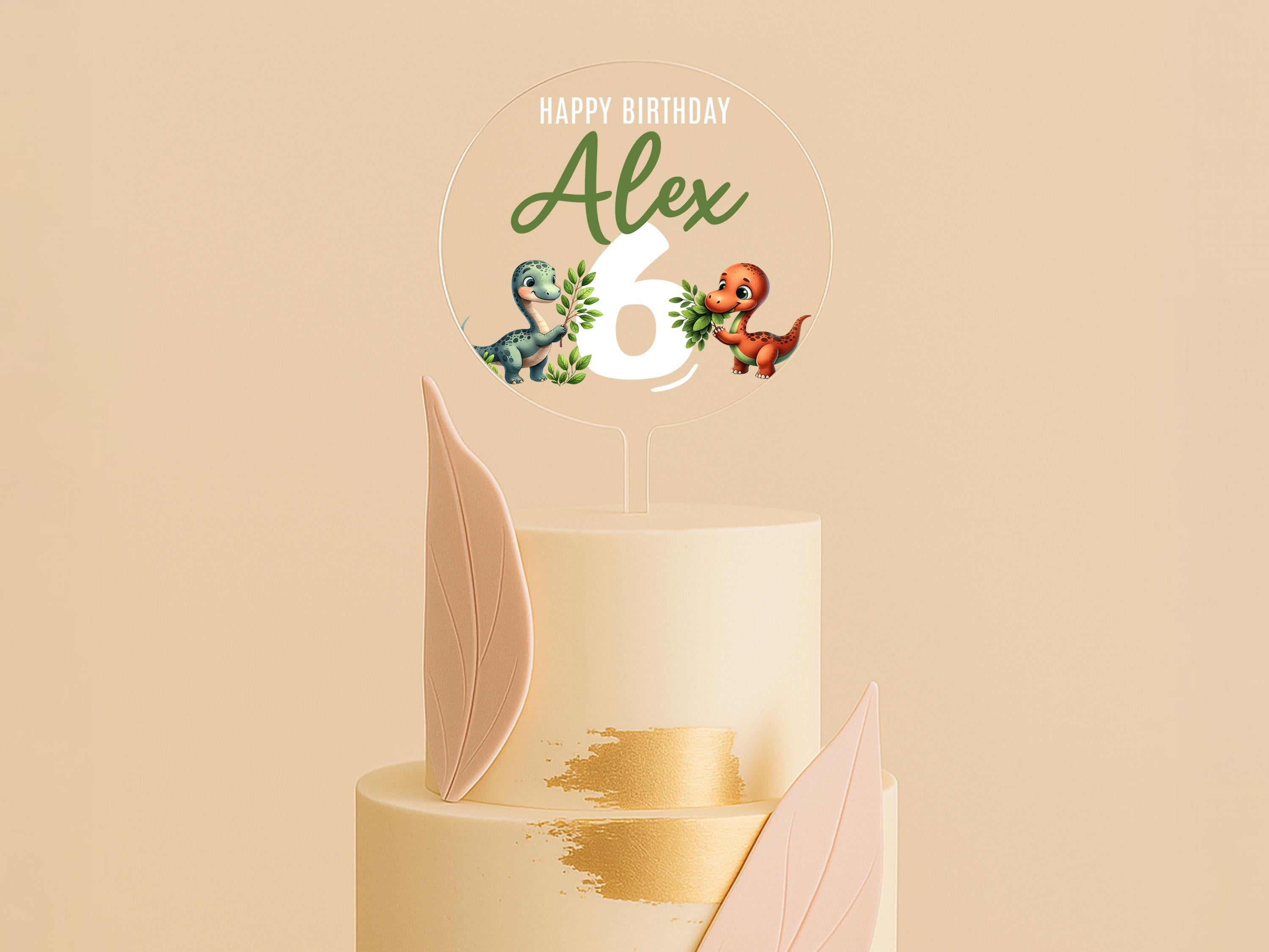 a three tiered cake with a happy birthday topper