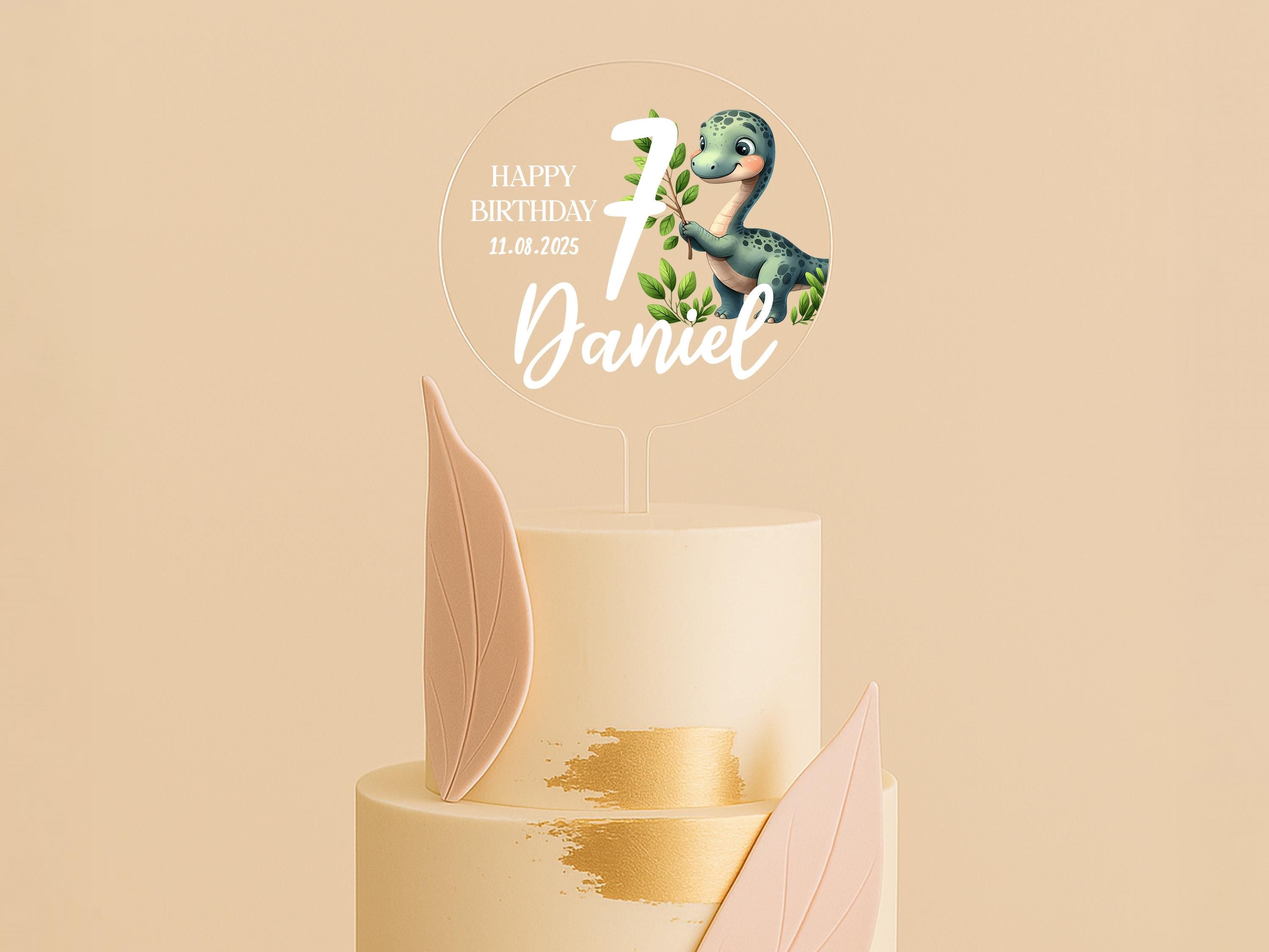 a birthday cake with a dinosaur topper on it