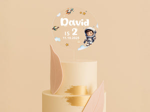 a three tiered cake with a cartoon character on top