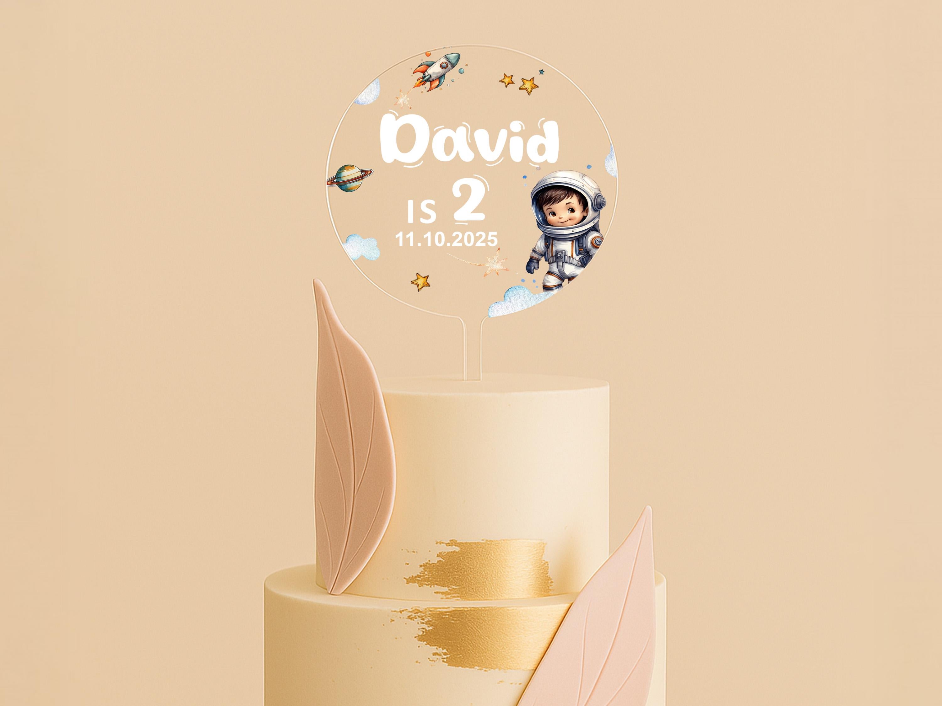 a three tiered cake with a cartoon character on top