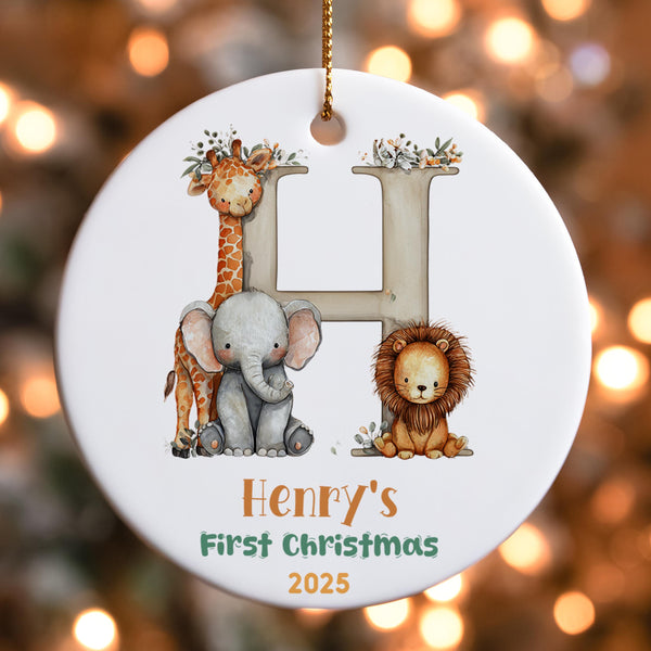 Personalised safari first Christmas ornament featuring letter H with giraffe, elephant and lion animals plus custom name Henry&#39;s First Christmas 2025
