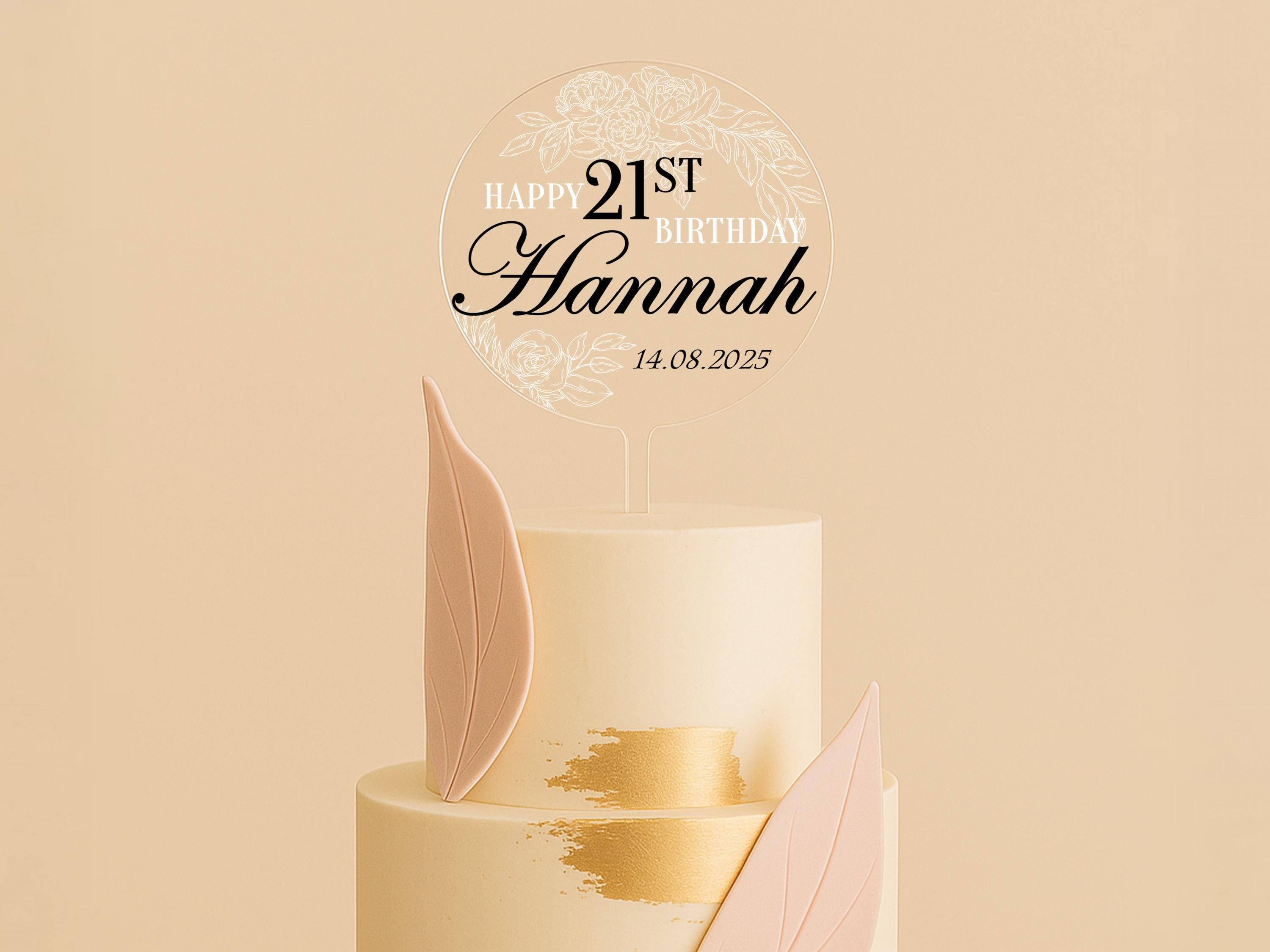 a three tiered cake with a happy 21st birthday sign on top