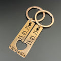 Personalised couple keyring set with engraved date and initials, two matching keychains in silver finish, interlocking heart design.