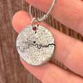 Personalised stainless steel keychain with custom engraved map on the front