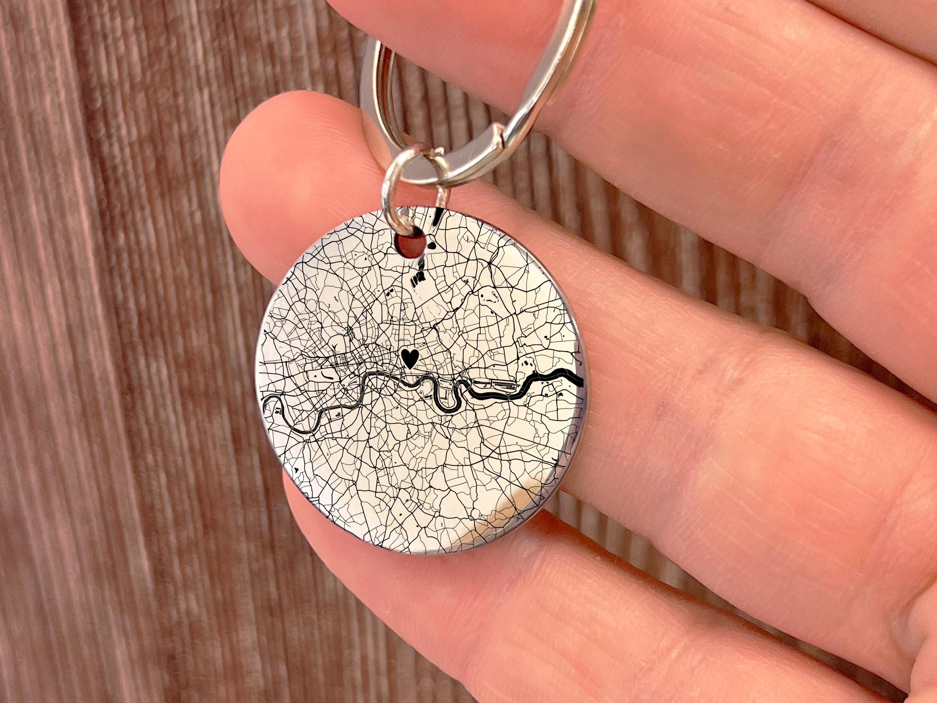 Personalised stainless steel keychain with custom engraved map on the front