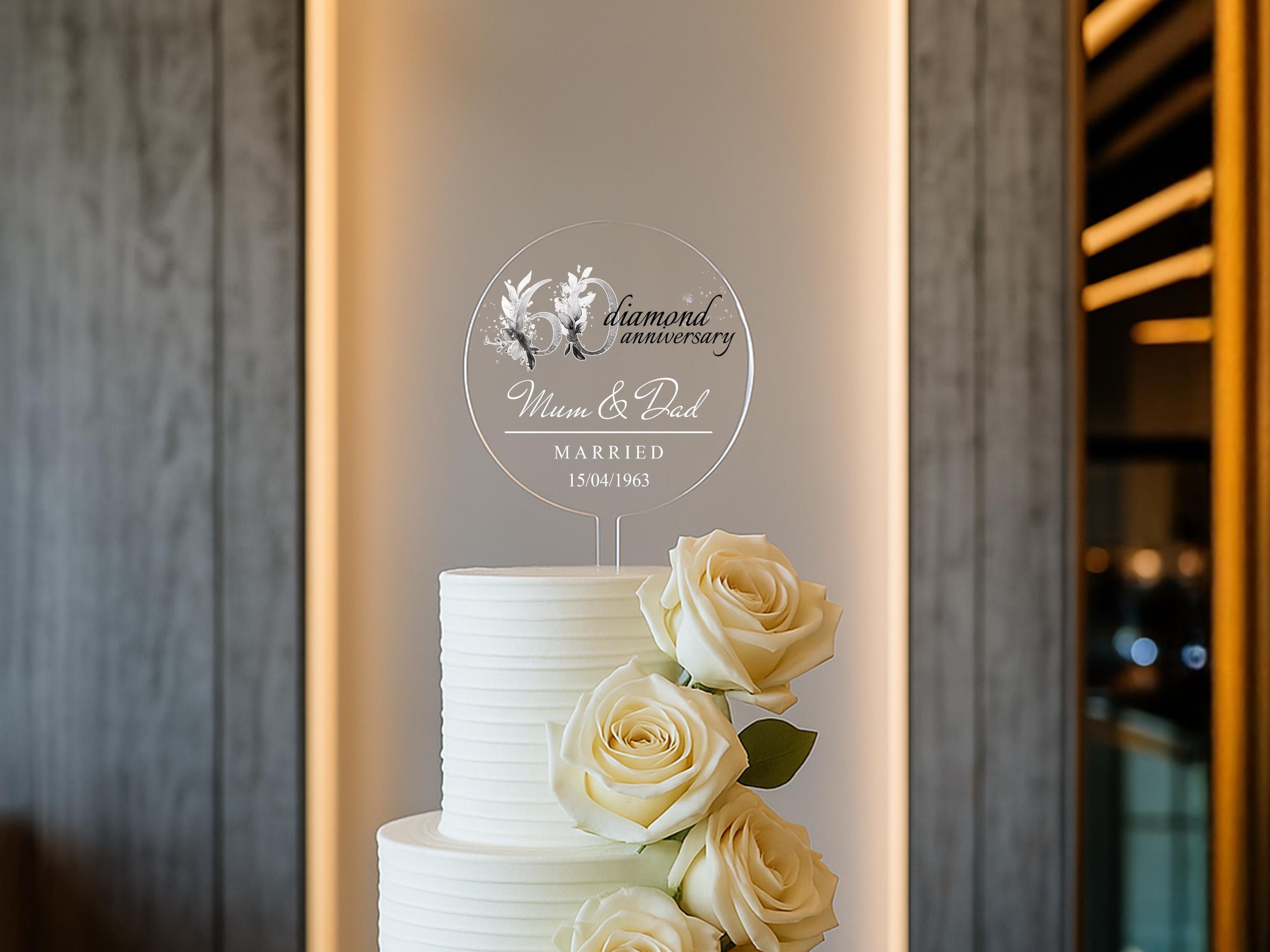 a white wedding cake with white roses on top