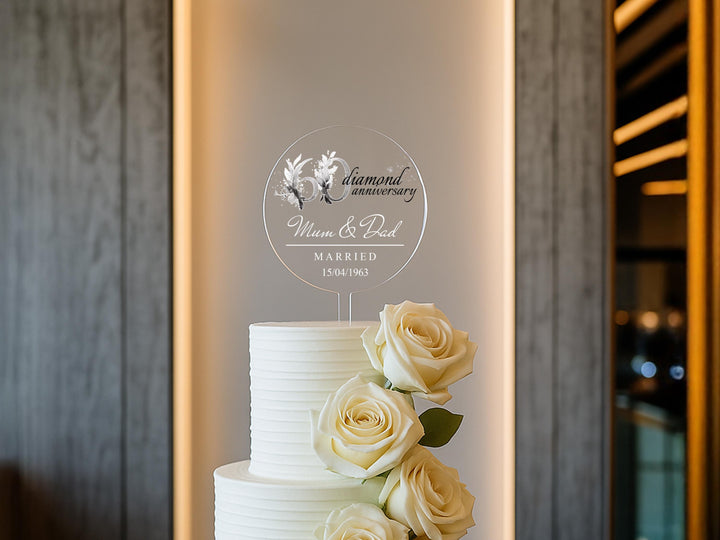 a white wedding cake with white roses on top