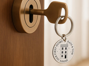 Engraved keychain keepsake with home date and names