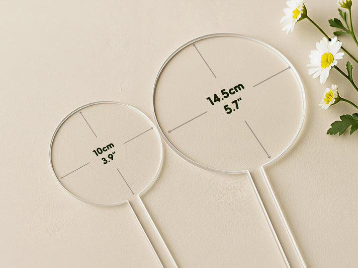 two transparent measuring tools, each marked with measurements in centimeters.