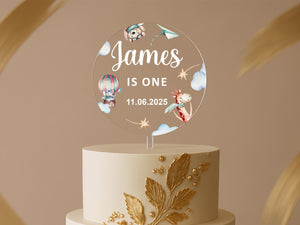 Clear round birthday topper with clouds, stars, and pastel artwork