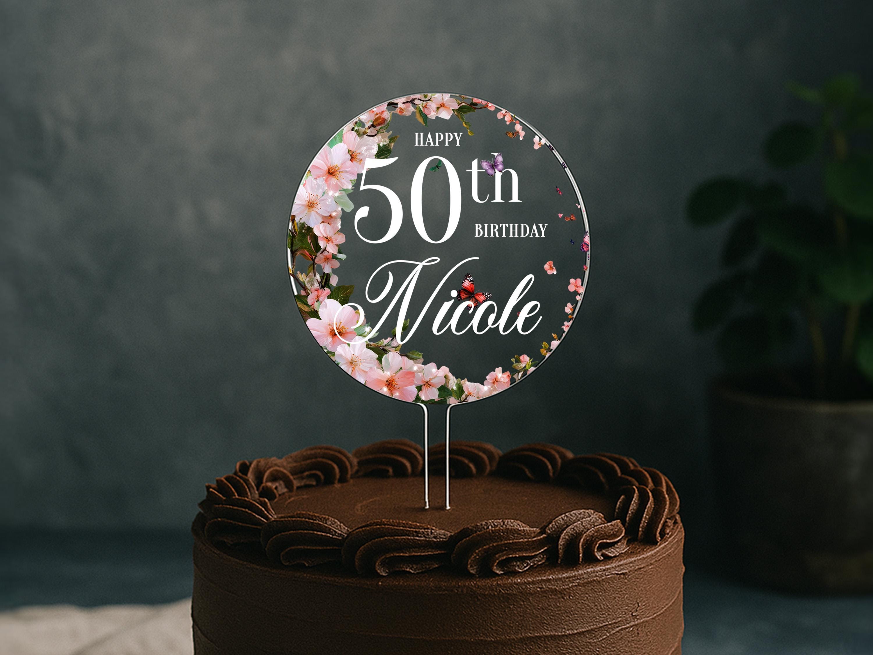 a chocolate cake with a 50th birthday sign on top