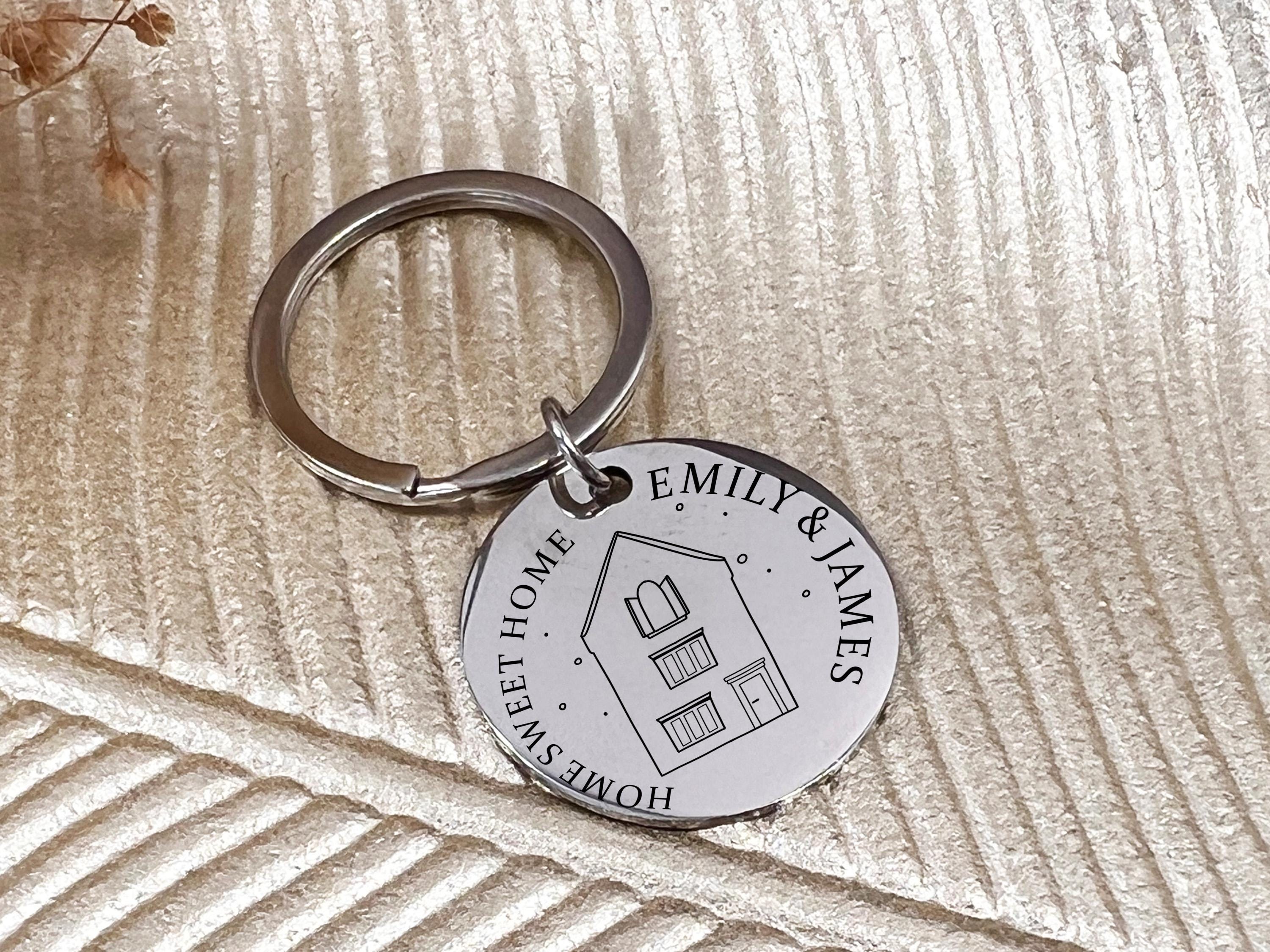 Polished stainless steel keyring with house line art