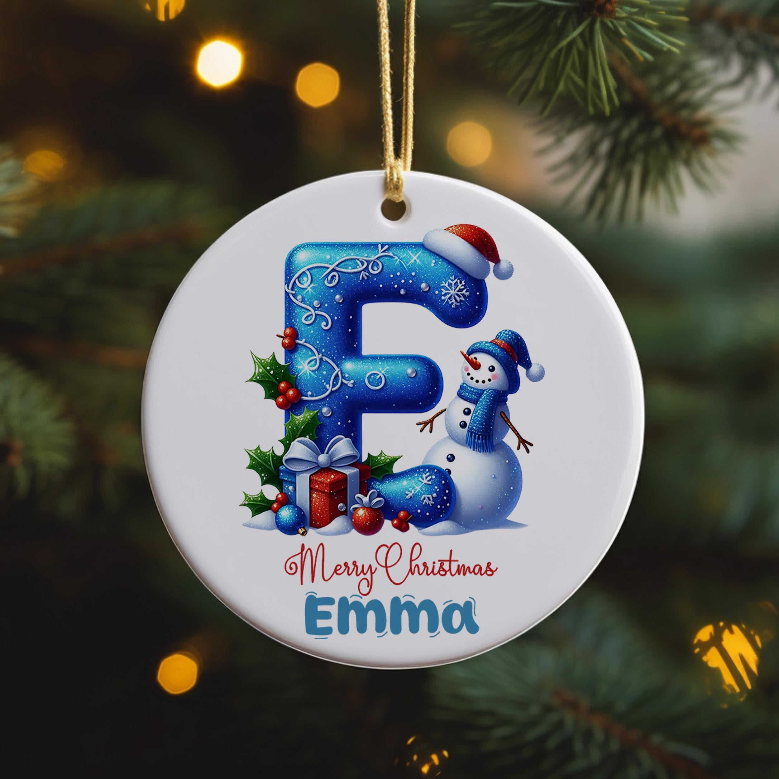 A round ornament with a snowman and presents, featuring the letter "E" in the center.