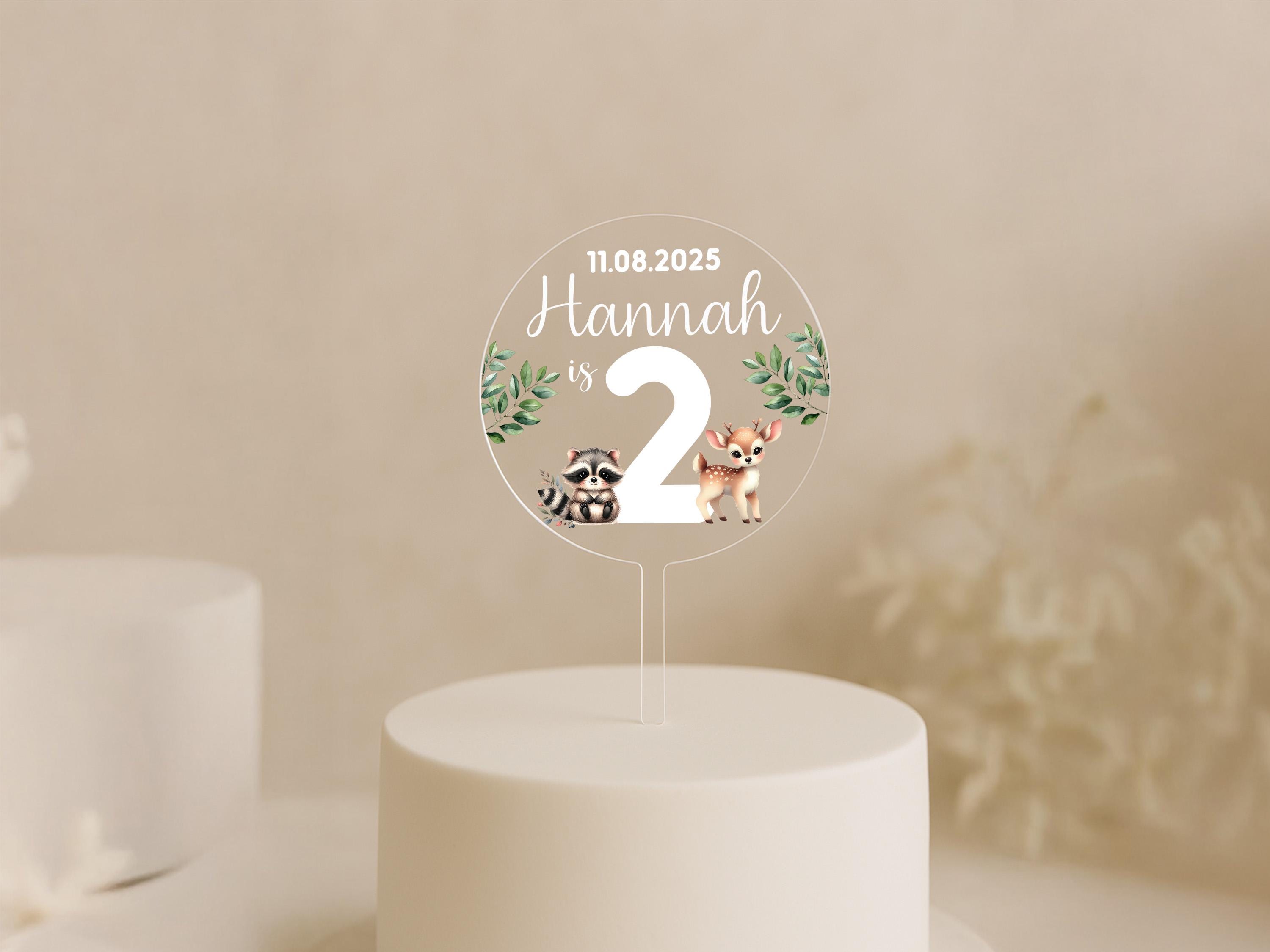 a white cake with a cake topper on it