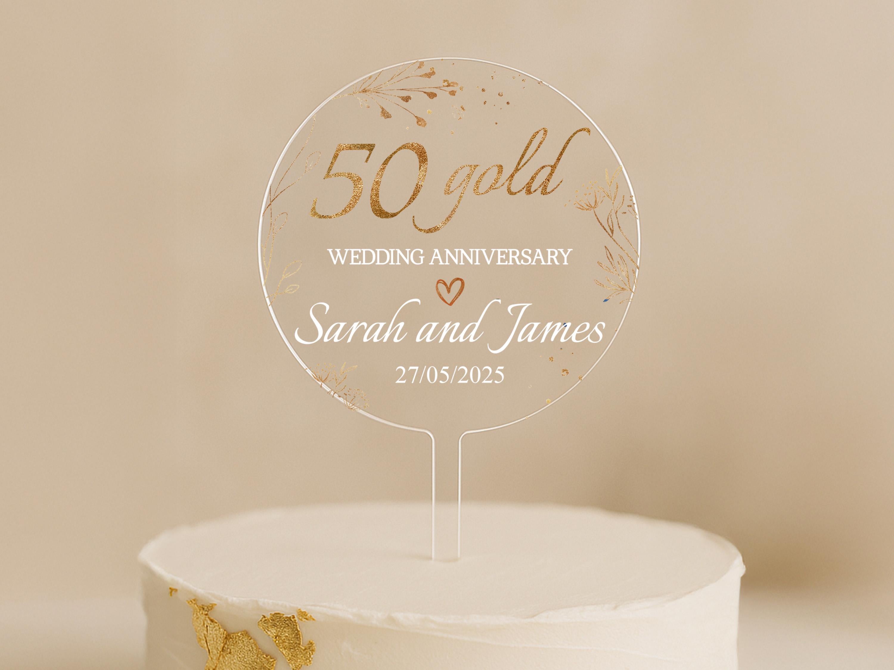 a cake with a 50th wedding anniversary cake topper