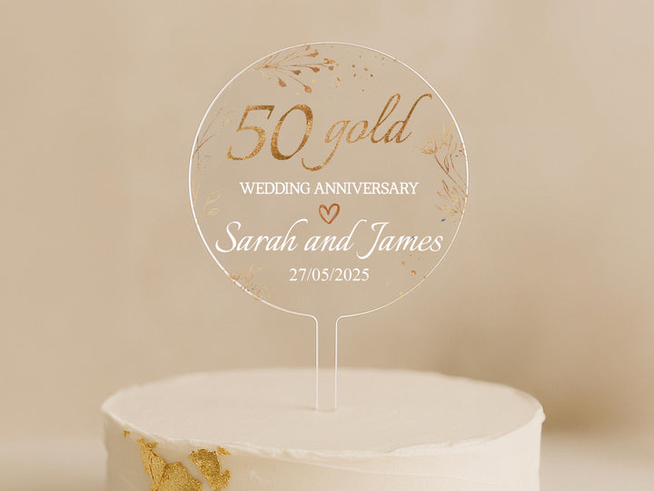 a cake with a 50th wedding anniversary cake topper
