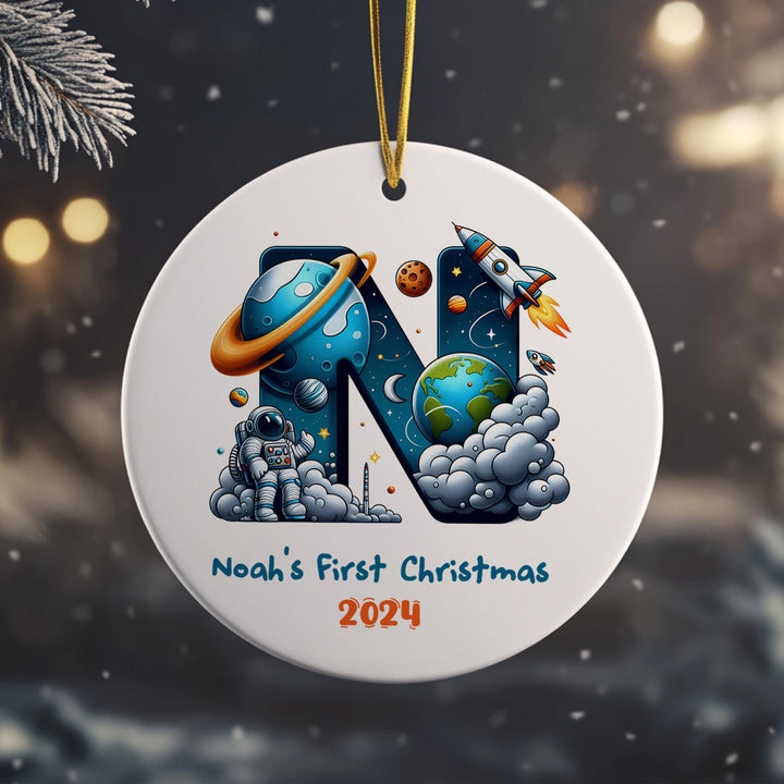 Celebrate the holidays with a cosmic twist! This personalized astronaut ornament features an initial surrounded by planets, stars, and rockets, with a brave astronaut in the center.
