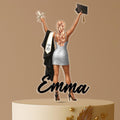Personalised graduation cake topper with female graduate holding diploma and cap, custom name “Emma,” and Class of 2025 design, displayed on a celebratory cake.