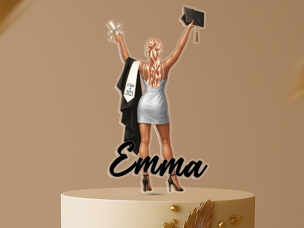 Personalised graduation cake topper with female graduate holding diploma and cap, custom name “Emma,” and Class of 2025 design, displayed on a celebratory cake.