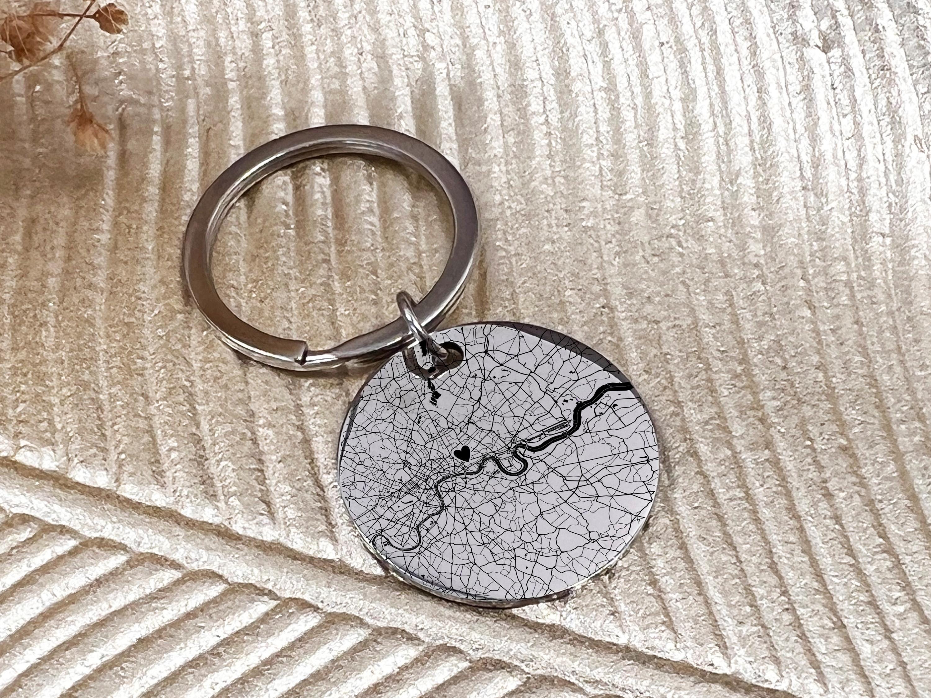 Double sided map keychain showing engraved location and special message