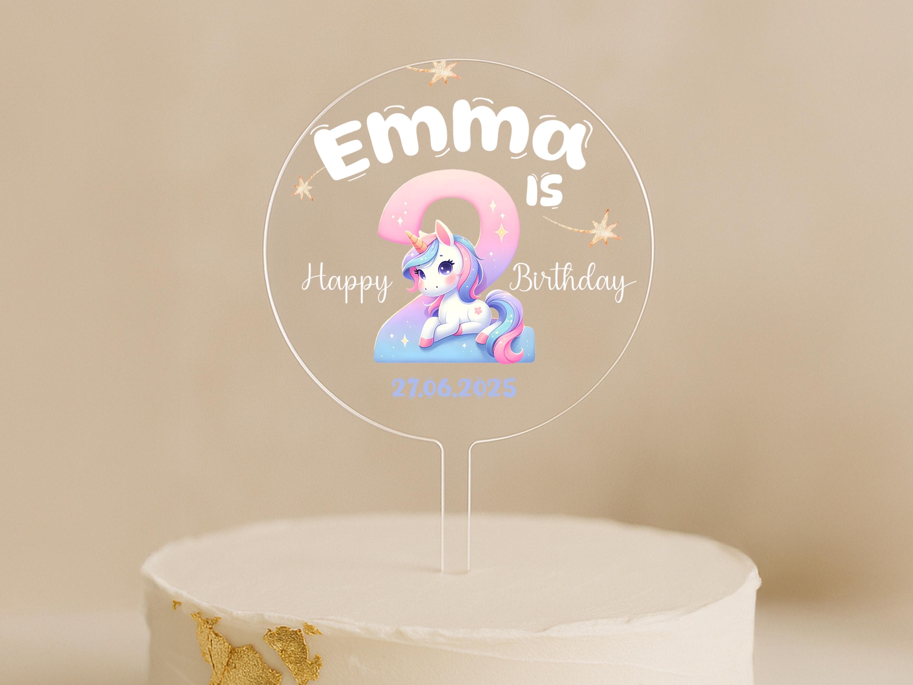 Birthday cake with personalised unicorn topper and date